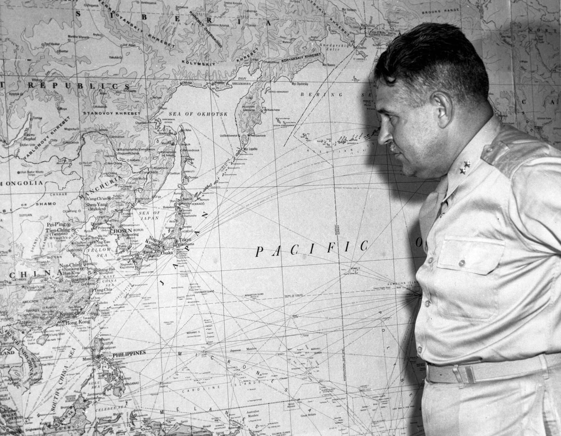 Leslie Groves, Manhattan Project director, with a map of the Far East 